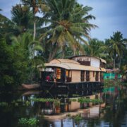 Houseboat moored on a tranquil Kerala backwater during monsoon season